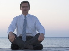 Man on the beach meditating